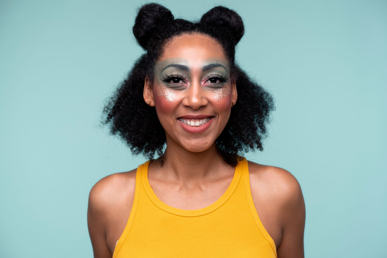 woman-smiling-in-space-buns